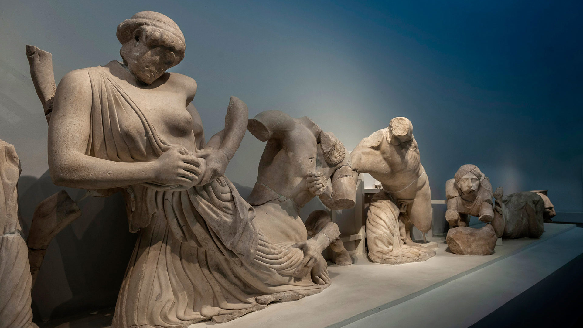 Marble figures from the battle of the Lapiths and Centaurs, part of the Temple of Zeus pediment in Olympia's museum